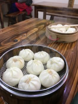 travel to China - portion of chinese baozi in cheap eatery in Yangshuo town spring season