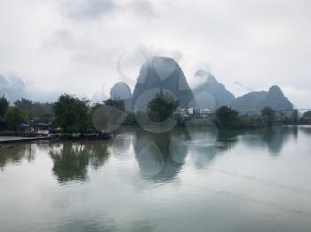 travel to China - calm waters of Yulong and Jinbao river and karst peaks in Yangshuo County in spring season
