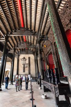 GUANGZHOU, CHINA - APRIL 1, 2017: tourists in patio of Chen Clan Ancestral Hall academic temple (Guangdong Folk Art Museum) in Guangzhou. The house was prepared for the imperial examinations in 1894