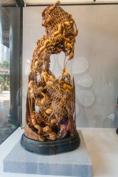 GUANGZHOU, CHINA - APRIL 1, 2017: carved wooden sculpture in window of Chen Clan Ancestral Hall (Guangdong Folk Art Museum) in Guangzhou city. The house was prepared for imperial examinations in 1894