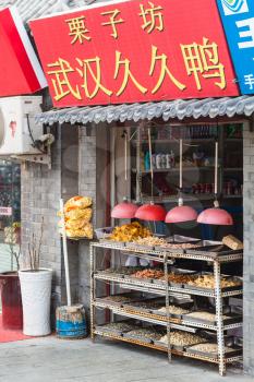 BEIJING, CHINA - MARCH 19, 2017: fast food stall on Liangshidian street in Dashilanr business area, on south of Tiananmen Square, west of Qianmen Street in morning