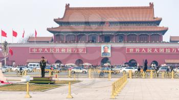 BEIJING, CHINA - MARCH 19, 2017: military guard and view of The Tiananmen monument (Gate of Heavenly Peace) on Tiananmen Square in spring. Tiananmen Square is central city square in Beijing