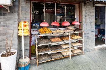 BEIJING, CHINA - MARCH 19, 2017: snacks on stall on Liangshidian street in Dashilanr business area, on south of Tiananmen Square, west of Qianmen Street in morning