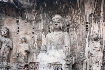 LUOYANG, CHINA - MARCH 20, 2017: carved The Big Vairocana sculpture in main Longmen Grotto (Longmen Caves). The complex was inscribed upon the UNESCO World Heritage List in 2000