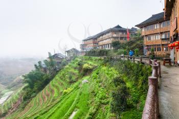 TIANTOUZHAI, CHINA - MARCH 23, 2017: view of terraced hills in Tiantouzhai village of Dazhai Longsheng country in spring. This is village in famous scenic area of Longji Rice Terraces in China