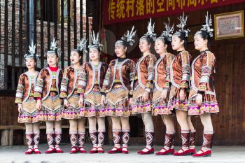 CHENGYANG, CHINA - MARCH 27, 2017: folk singers in Culture Show on square of Folk Custom Centre of Chengyang village of Sanjiang County in spring. Chengyang includes eight villages of the Dong people