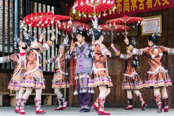 CHENGYANG, CHINA - MARCH 27, 2017: folk dancers in Culture Show on square of Folk Custom Centre of Chengyang village of Sanjiang County in spring. Chengyang includes eight villages of the Dong people