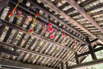 CHENGYANG, CHINA - MARCH 27, 2017: toys on ceiling of Dong people Chengyang Wind and Rain Bridge (Fengyu, Yongji or Panlong Bridge) in Sanjiang Dong Autonomous County in spring season