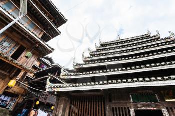 CHENGYANG, CHINA - MARCH 27, 2017: Pagoda and shop in Folk Custom Centre of Chengyang village of Sanjiang Dong Autonomous County in spring. Chengyang includes eight villages of the Dong people