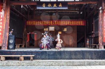CHENGYANG, CHINA - MARCH 27, 2017: dong people in Culture Show on square of Folk Custom Centre of Chengyang village of Sanjiang County in spring. Chengyang includes eight villages of the Dong people