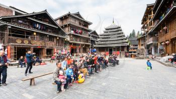 CHENGYANG, CHINA - MARCH 27, 2017: visitors in Dong Culture Show on square of Folk Custom Centre of Chengyang village of Sanjiang County in spring. Chengyang includes eight villages of Dong people