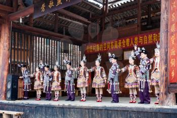 CHENGYANG, CHINA - MARCH 27, 2017: actors in Dong Culture Show on square of Folk Custom Centre of Chengyang village of Sanjiang County in spring. Chengyang includes eight villages of the Dong people