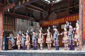 CHENGYANG, CHINA - MARCH 27, 2017: players in Dong Culture Show on square of Folk Custom Centre of Chengyang village of Sanjiang County in spring. Chengyang includes eight villages of the Dong people