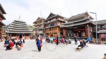 CHENGYANG, CHINA - MARCH 27, 2017: people on square of Folk Custom Centre during Dong Culture Show of Chengyang village of Sanjiang County in spring. Chengyang includes eight villages of Dong people