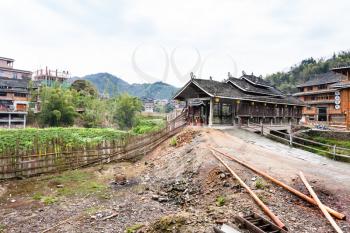 CHENGYANG, CHINA - MARCH 27, 2017: country road to Chengyang Wind and Rain Bridge in Sanjiang Country in spring. In Chengyang there are eight villages and several Fengyu Bridges of the Dong people