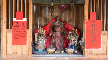 CHENGYANG, CHINA - MARCH 27, 2017: religious altar with figures in Chengyang village of Sanjiang Dong Autonomous County in spring. Chengyang includes eight villages of the Dong people
