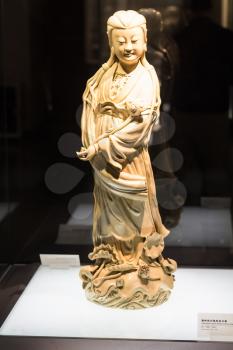 GUANGZHOU, CHINA - MARCH 31, 2017: porcelain figure in Chen Clan Ancestral Hall (Guangdong Folk Art Museum) in Guangzhou city. The house was prepared for imperial examinations in 1894