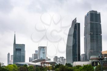 GUANGZHOU, CHINA - MARCH 31, 2017: modern buildings and Opera House in Zhujiang New Town of Guangzhou in cloudy day. Guangzhou is the third most-populous city in China with population about 13,5 mln