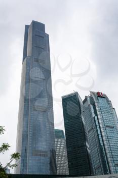 GUANGZHOU, CHINA - MARCH 31, 2017: gray clouds over modern towers in Zhujiang New Town of Guangzhou city in rainy day. Guangzhou is the third most-populous city in China with population about 13,5 mln