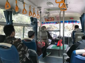 DAZHAI, CHINA - MARCH 25, 2017: people in bus on road to scenic area of Dazhai country Longsheng Rice Terraces (Dragon's Backbone terrace, Longji Rice Terraces) in spring season.