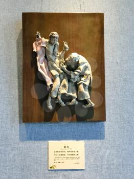GUANGZHOU, CHINA - APRIL 1, 2017: Porcelain sculpture on wall in Chen Clan Ancestral Hall (Guangdong Folk Art Museum) in Guangzhou city. The house was prepared for imperial examinations in 1894