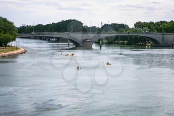 Travel to Provence, France - view of Rhone river with bridge Pont Daladier and canoes in Avignon city