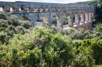 Travel to Provence, France - ancient Roman aqueduct Pont du Gard through Gardon River near Vers-Pont-du-Gard town