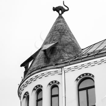 travel to Latvia - cat figure on turret rooftop of Cat House in Riga city in autumn. Palace was built in 1909, designed by architect Friedrich Scheffel