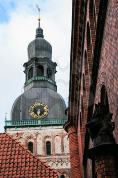 travel to Latvia - tower of Riga Cathedral (Rigas Doms) over old houses in autumn