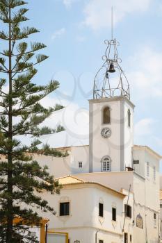 Travel to Algarve Portugal - bell tower of Santa Ana Church ( Igreja de Sant'ana) in old town of Albufeira city