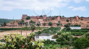 Travel to Algarve Portugal - view of Castle of Silves (Castelo de Silves) from village side in Silves city