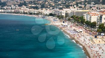 Travel to Provence, France - panoramic view of urban beach near Promenade des Anglais and hotel and apartment houses of Nice city on Cote d'Azur (Coast of Azure) of French Riviera in summer