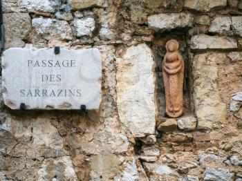Travel to Provence, France - Virgin figurine in wall of medieval house on street Passage des Sarrazins in town Eze