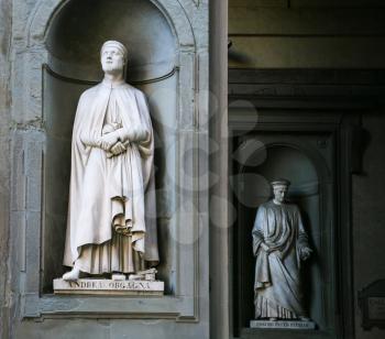 FLORENCE, ITALY - JUNUARY 12, 2009: Statues of Italian artist Andrea Orcagna carved by Niccolo Bazzanti and Lord Cosimo di Giovanni de Mediciin (The Elder) in Uffizi outside gallery in Florence city