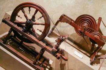 FLORENCE, ITALY - JANUARY 9, 2009: old wooden spinning wheels in Museum of Ancient Florentine Home in Palazzo Davanzati. The Palace was built by the Davizzi family around mid-14th century