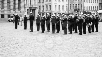 RIGA, LATVIA - SEPTEMBER 10, 2008: military band playing music on Doma Laukums square in Old Riga town in autumn. Riga city historical centre is a UNESCO World Heritage Site