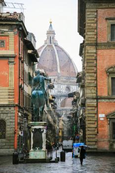 FLORENCE, ITALY - JANUARY 7, 2009: view of Cathedral Duomo through Via Servi from Piazza Santissima Annunziata in winter. Via dei Servi is one of the main streets of city, connects two large squares