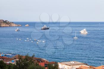 travel to Sicily, Italy - ships in Ionian Sea near Giardini Naxos town in summer