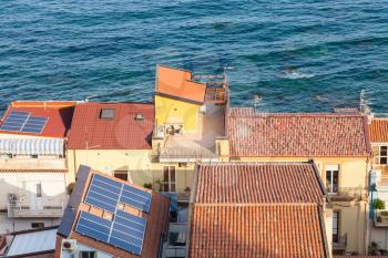 travel to Sicily, Italy - above view of urban houses in Giardini Naxos town in summer