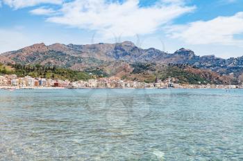 travel to Sicily, Italy - Ionian sea and view of Giardini Naxos town in summer