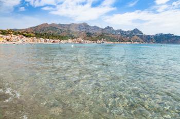 travel to Sicily, Italy - clear water on Ionian sea near Giardini Naxos town in summer