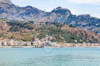 travel to Sicily, Italy - Giardini Naxos town on coast of Ionian sea and Taormina city on cape in summer
