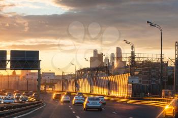 MOSCOW, RUSSIA - JULY 3, 2017: car traffic on Luzhnetskaya overpass of Third Ring Road on summer sunset. The Third Ring it is one of Moscow's main roads, it is 35 km in length, about 10 km in diameter