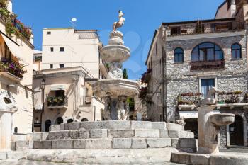 TAORMINA, ITALY - JUNE 29, 2017: baroque style fountain (Quattro Fontane di Taormina) on Piazza Del Duomo in summer day. Taormina is resort town on Ionian Sea in Sicily