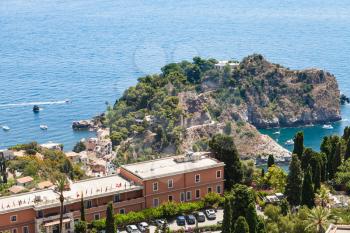 TAORMINA, ITALY - JUNE 29, 2017: above view of cape near Isola Bella island in Ionian Sea from Taormina. From 1990 there is a nature reserve, administrated by the Italian World Wide Fund for Nature