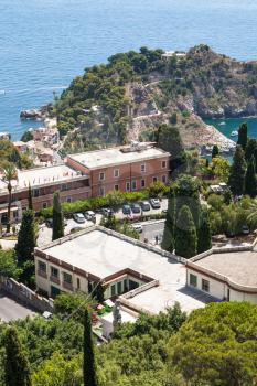 TAORMINA, ITALY - JUNE 29, 2017: road on cape near Isola Bella island in Ionian Sea from Taormina city. From 1990 there is a nature reserve, administrated by the Italian World Wide Fund for Nature