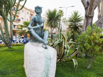 GIARDINI NAXOS, ITALY - JUNE 30, 2017: Sileno (Silenus) statue on waterfront in Giardini-Naxos town in summer evening. Giardini Naxos is seaside resort on Ionian Sea coast since the 1970s