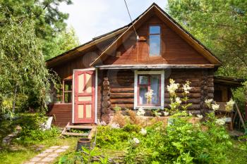 front view of wooden house in russian village in sunny summer day