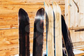 wide hunting skis near door of wooden cottage in winter in russian village in Smolensk region of Russia