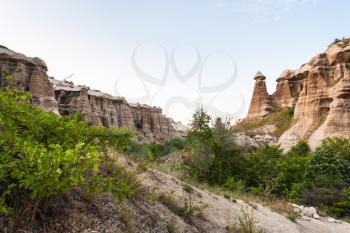 Travel to Turkey - old rocks in ravine near Goreme town in Cappadocia in spring evening
